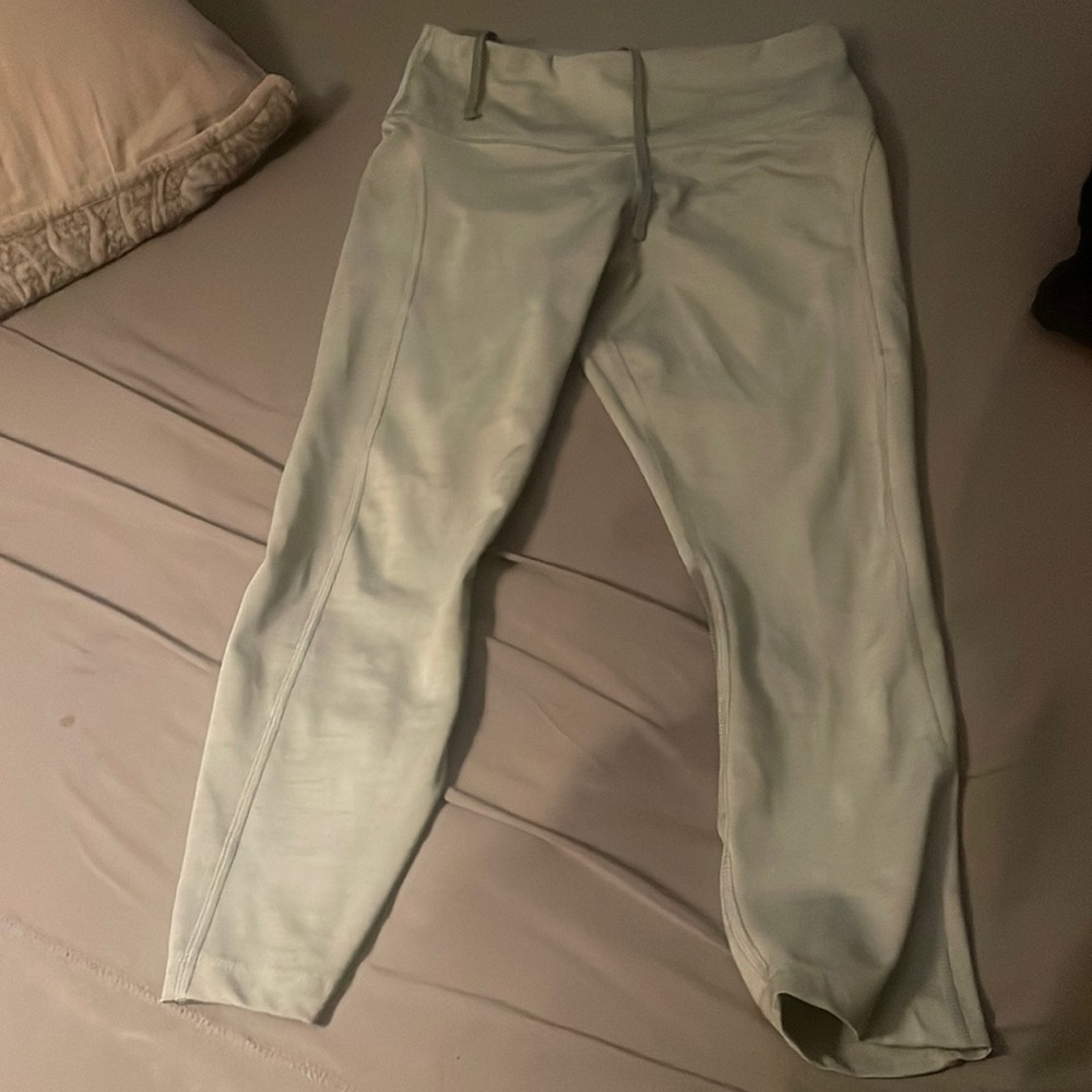 Light grey Nike leggings. I still have baby waist and they are too snug lol. Med